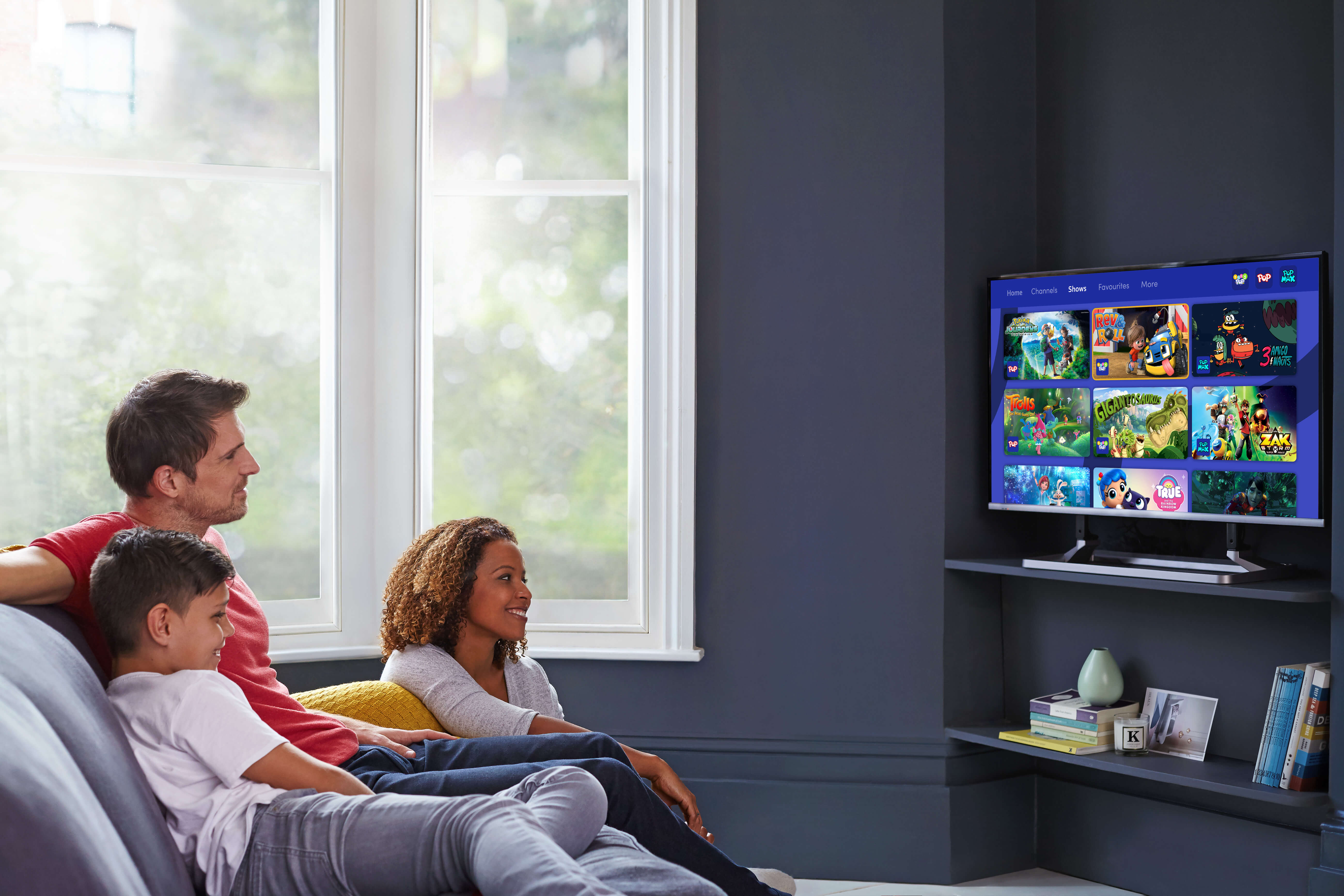 Family group watching POP Player on Freeview Play