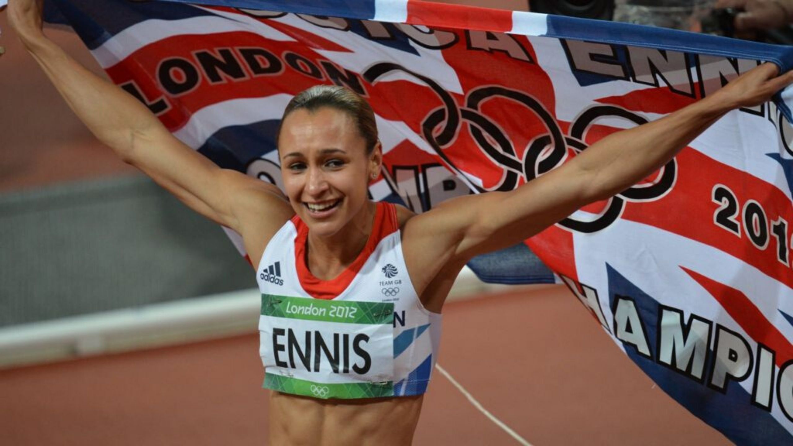Jessica Ennis-Hill competing in the 2012 Olympics whilst carrying a Union Jack flag