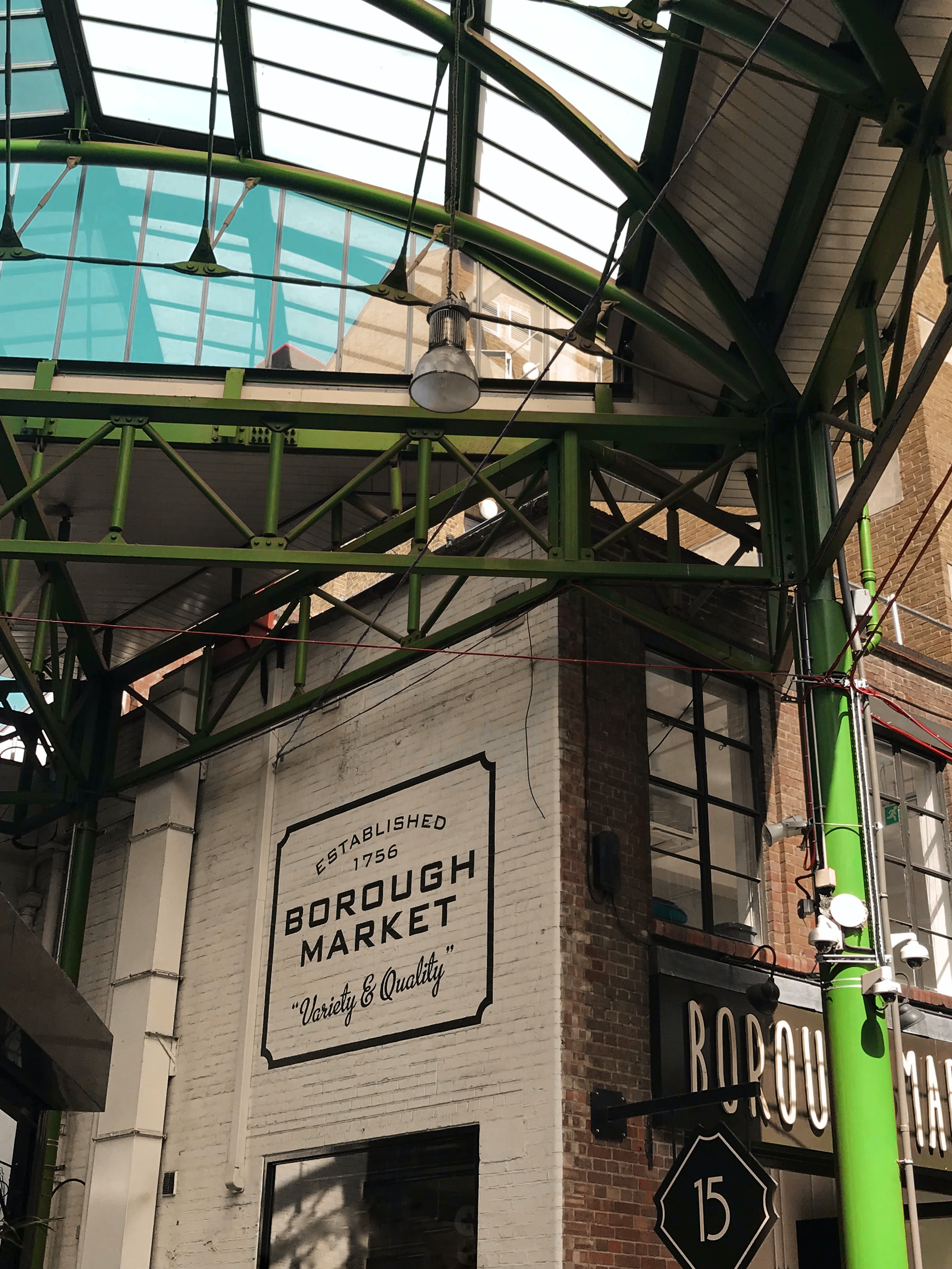 Borough Market: brown and green wooden signage
